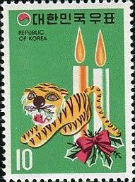 Colnect-2723-457-Tiger-and-candles.jpg