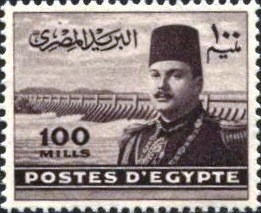 Colnect-1281-960-King-Farouk-in-front-of-Aswan-Dam-Mosque.jpg