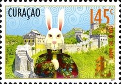 Colnect-1629-027-Rabbit-in-Chinese-costume-with-the-Great-Wall.jpg
