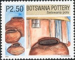 Colnect-1424-463-Finished-Setswana-Pots-under-the-Shade-of-a-House.jpg