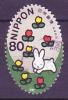 Colnect-910-879-Rabbit-and-flowers.jpg