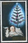 Colnect-2122-652-Sleeping-Child-and-Christmas-Tree.jpg