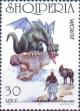 Colnect-2189-314-Dragon-on-rock-looking-at-warrior-donkey.jpg