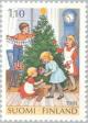 Colnect-159-792-Children-decorate-the-christmas-tree.jpg