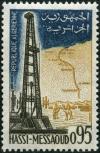 Colnect-865-282-Oil-derrick-and-pipeline-at-Hassi-Messaoud.jpg