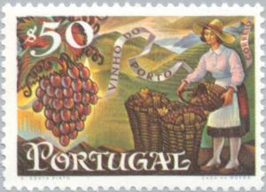 Colnect-172-146-Grapes-and-woman-filling-baskets.jpg