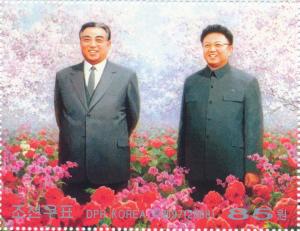 Colnect-3199-598-Kim-Il-Sung-and-Kim-Jong-Il-in-the-flowerbed.jpg