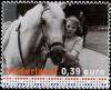 Colnect-702-681-Princess-Beatrix-with-a-horse-1951.jpg