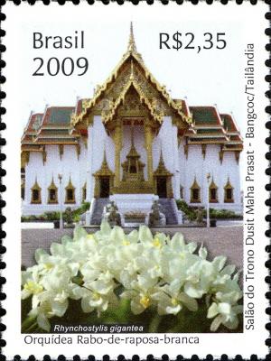 Colnect-447-569-Thai-architecture-and-orchid-flowers.jpg