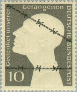 Colnect-152-144-Prisoner-behind-barbed-wire.jpg