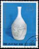 Colnect-1611-202-White-ceramic-vase-Ri-dynasty.jpg