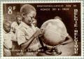 Colnect-184-437-Independence-of-Congo-Boy-pointing-on-globe.jpg