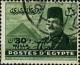 Colnect-1281-997-King-Farouk-in-front-of-the-Pyramids-of-Gizeh-with-overprint.jpg