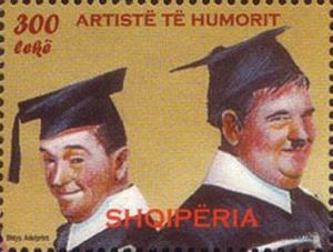 Colnect-609-969-Laurel-and-Hardy-wearing-mortarboards.jpg
