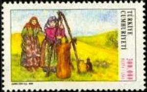 Colnect-820-695-Women-in-the-Churning-at-the-Field.jpg
