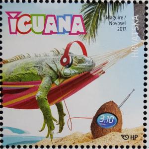 Colnect-3865-935-Green-Iguana-Iguana-iguana-in-a-Hammock-with-Headphones.jpg