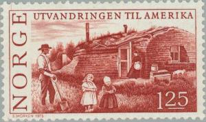 Colnect-161-841-Colonist-family-in-front-of-their-huts.jpg