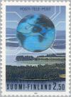 Colnect-160-040-Landscape-with-P-auml-ij-auml-nne-Lake-world-map-postal-badge.jpg
