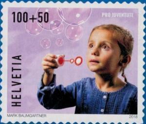 Colnect-5267-439-Child-blowing-bubbles.jpg
