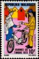 Colnect-2595-192-Postman-giving-a-letter.jpg