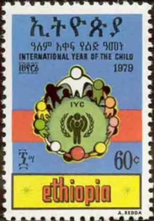 Colnect-2771-329-IYC-emblem-surrounded-by-children.jpg