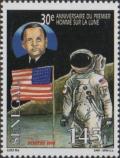 Colnect-2231-087-Astronaut-by-American-Flag.jpg
