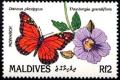 Colnect-2371-661-Monarch-Butterfly-Danaus-plexippus-Blue-Thunbergia-Thunb.jpg