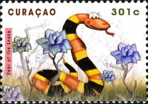 Colnect-2603-476-Snake-and-flowers.jpg