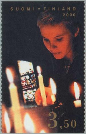 Colnect-160-572-Lighting-a-candle-in-the-Turku-Cathedral.jpg