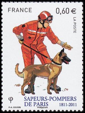 Colnect-5237-758-Dog-Handlers-With-Search-Dog.jpg