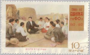 Colnect-2621-783-Kim-Il-Sung-sitting-with-villagers.jpg