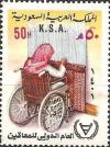 Colnect-2329-271-Woman-in-wheelchair-in-Weaving.jpg