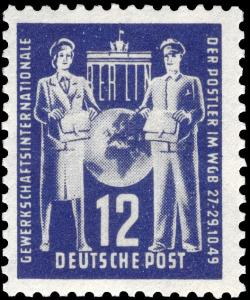 Colnect-483-725-Brandenburg-Gate-Berlin--Globe-between-postwoman-and-postma.jpg