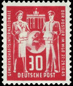 Colnect-483-726-Brandenburg-Gate-Berlin--Globe-between-postwoman-and-postma.jpg