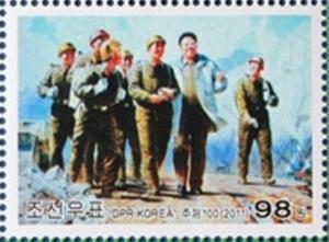 Colnect-2954-996-Kim-Jong-Il-and-militiamen.jpg