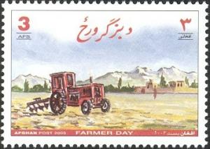 Colnect-543-708-Tractor-ploughing.jpg