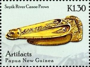 Colnect-2553-240-Sepik-River-canoe-prow-with-man--s-face-carved-at-tip.jpg