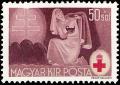 Colnect-822-412-Red-Cross-nurse-taking-care-of-wounded.jpg