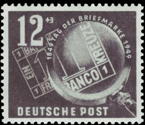 Colnect-1976-034-First-Bavarian-stamp-under-a-magnifying-glass.jpg