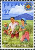 Colnect-2238-223-President-and-Mrs-Marcos-harvesting-miracle-rice.jpg