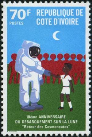 Colnect-3704-184-Astronaut-shaking-hands-with-boy.jpg