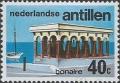 Colnect-946-176-Beach-pavilion-and-boat-Bonaire.jpg