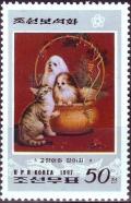 Colnect-2500-167-Two-dogs-in-basket.jpg