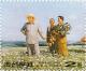 Colnect-3259-637-Kim-Il-Sung-with-farm-workers-in-the-potato-field-Painting-.jpg
