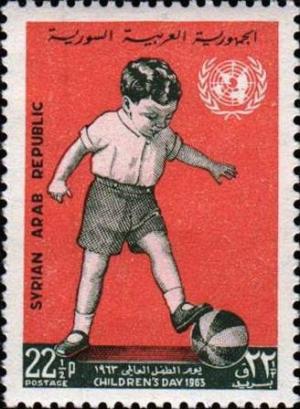 Colnect-1495-436-Boy-playing-Ball-and-UN-emblem.jpg