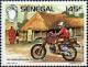 Colnect-2089-706-Motor-Cyclist-and-Village.jpg