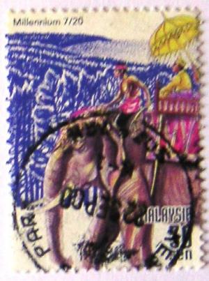 Colnect-531-034-Asian-Elephant-Elephas-maximus-with-Howdah.jpg