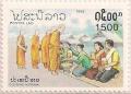 Colnect-748-731-People-giving-food-to-monks.jpg