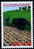 Colnect-3979-184-Plowing-farmer.jpg