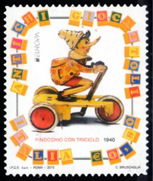 Colnect-2668-012-Old-toys-Pinocchio-with-tricycle.jpg